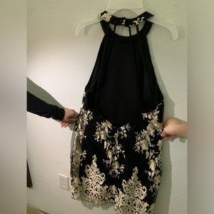 A large women’s dress from Charlotte Russe black and gold